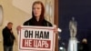 Holding a poster that reads "He's not our tsar," a Moscow activist stages a one-person protest against proposed constitutional amendments that would allow Russian leader Vladimir Putin to run for an additional two terms as president. 
