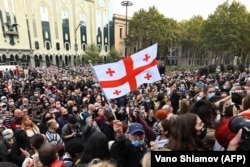 Opposition members protesting the results in Tbilisi gathered outside parliament on November 1, and then marched up the side of a hill to the space-ship-style residence of ruling party founder, Bidzina Ivanishvili.