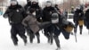Russian police detain a man during St. Petersburg's unauthorized January 31 protest for the release of jailed opposition leader Aleksei Navalny. 