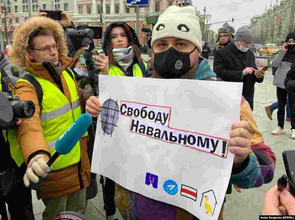 This man, later seen detained, appeared to be one of the first to display a poster (declaring "Freedom for Navalny") on Moscow's Pushkin Square. 