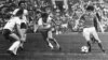  Soviet forward Sergei Andreyev faces off against East German players in the men's soccer semi-final at the 1980 Moscow Olympics. 