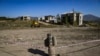 An unexploded, Russian-made BM-30 Smerch rocket is seen on October 12, 2020 in the outskirts of Stepanakert, known to Azerbaijanis as Khankendi, the main town in the breakaway region of Nagorno-Karabakh. Though Russia is a co-chair of the Organization for Security and Cooperation in Europe group coordinating negotiations between Armenia and Azerbaijan, it has sold weapons&nbsp; to both sides of the conflict.