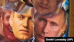 Face masks depicting Russian President Vladimir Putin, right, and Russian opposition leader Aleksei Navalny, left, are shown for sale in St. Petersburg, Russia on January 17, 2021